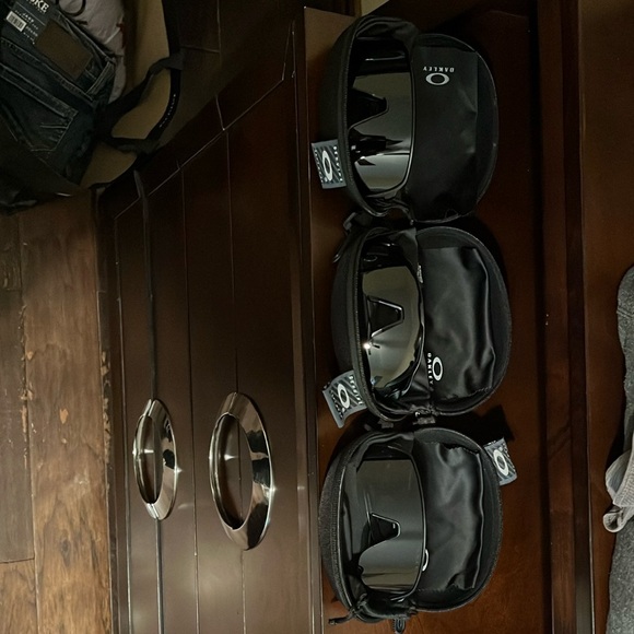 Oakley Trio of Sleek Black Sunglasses includes their case also.